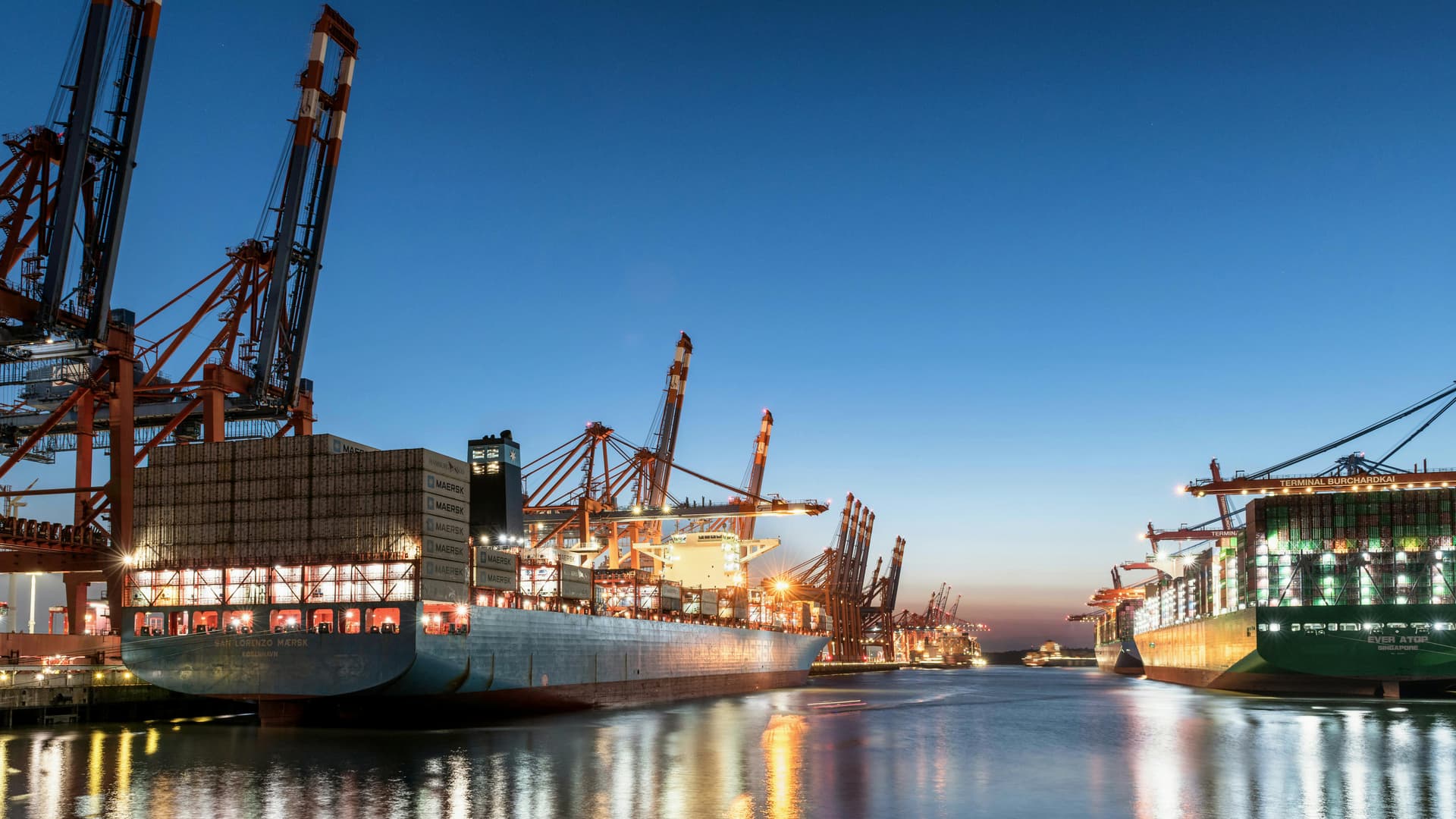 Modern port operations with container ships and cranes